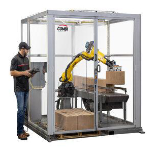 Employees working alongside robotic packaging solutions